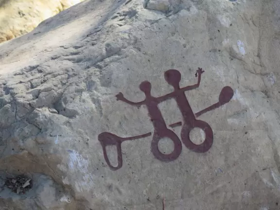 Modern playground with Chumash Indian huts and canoe, seals and whales to climb, roller slide, rainbow bridge, and bald eagle in a nest.