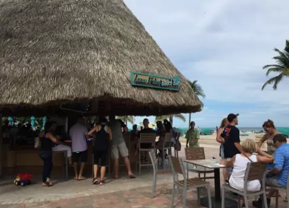Wide pedestrian and bike path that runs along the beach and past cafes.