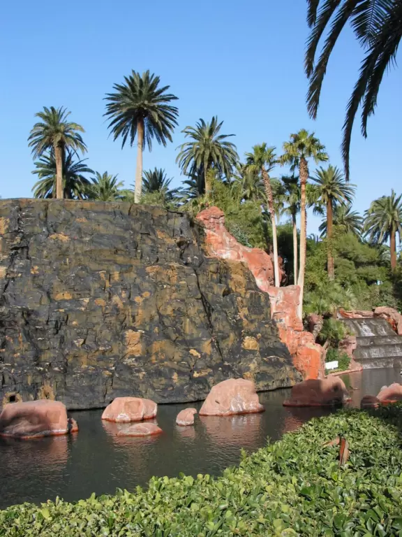 An oasis of lush landscaping, waterfalls galore, a volcano that erupts, and a classy casino with tropical fish tank.