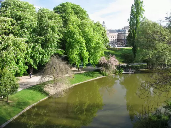 Beautiful, hilly park with jade green lake and fake caves and rock formations.