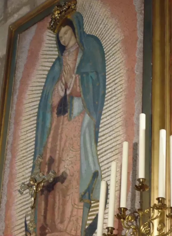 Iconic Gothic church on the Seine river with a huge plaza, Roman ruins, and gardens with play equipment.