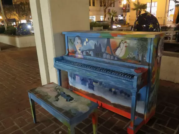 Street with beautiful historic arcades, cafes, and Spanish architecture.