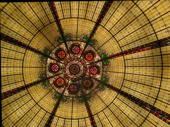 The Eiffel Tower, the Arc de Triomphe, and indoor cobblestone streets that look like Parisian streets, with Art-Nouveau Metro signs.