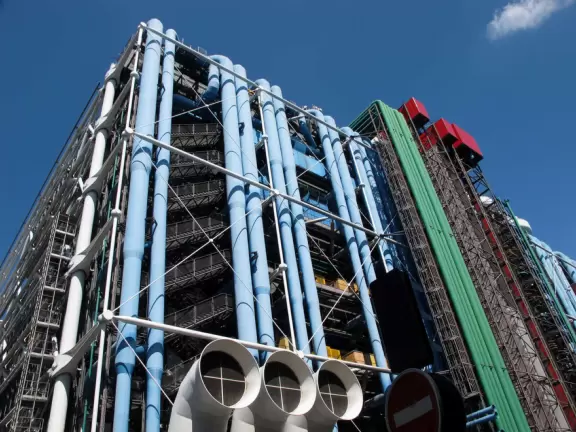 Modern art museum and public library with sunny, slanted square in front, and awesome modern art fountain.
