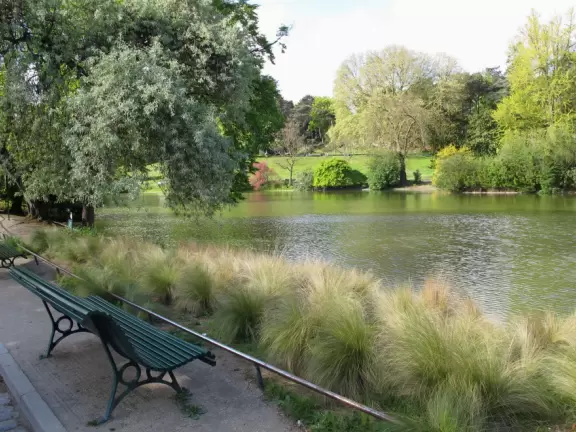 Magical park with lake, hillsides with little daisies, rose garden, and hidden walkways.