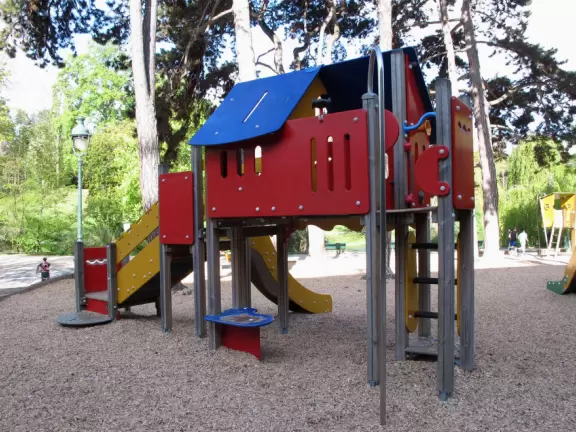 Magical park with lake, hillsides with little daisies, rose garden, and hidden walkways.