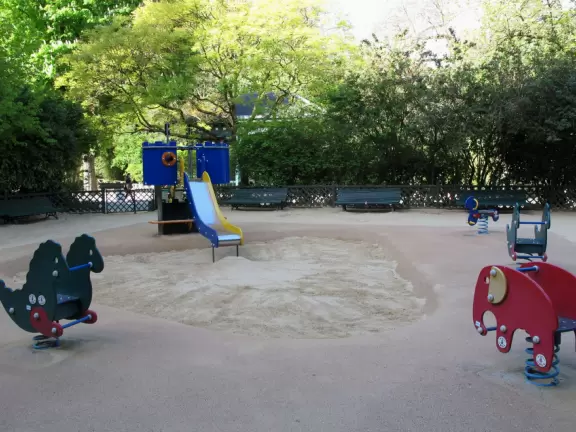 Magical park with lake, hillsides with little daisies, rose garden, and hidden walkways.