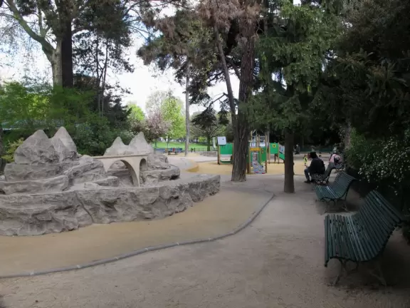 Magical park with lake, hillsides with little daisies, rose garden, and hidden walkways.