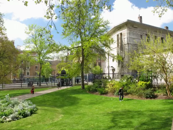 Magical park with lake, hillsides with little daisies, rose garden, and hidden walkways.