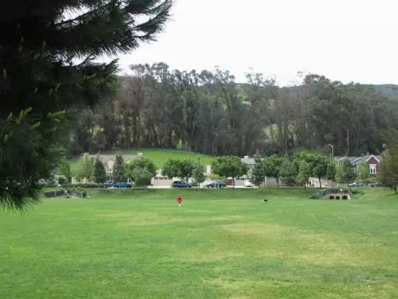 Lovely neighborhood walk past sweet houses and gardens, near fragrant hills with eucalyptus and wildflowers, plus a playground and lawn.