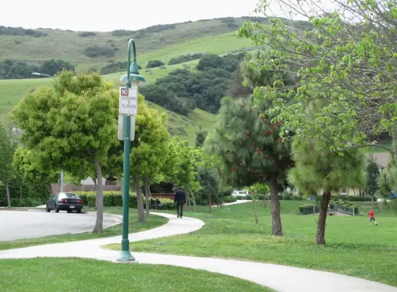 Lovely neighborhood walk past sweet houses and gardens, near fragrant hills with eucalyptus and wildflowers, plus a playground and lawn.