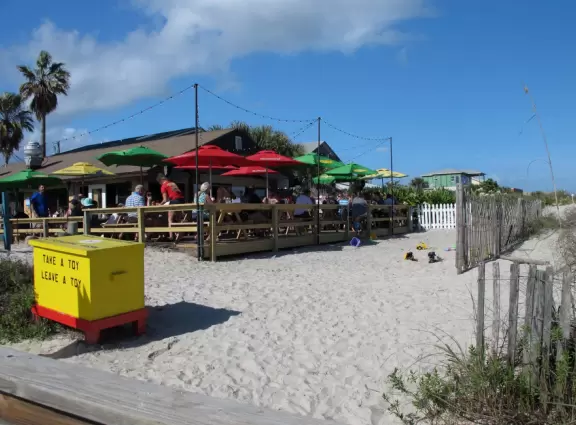 Broad beach with sand that has red flecks!