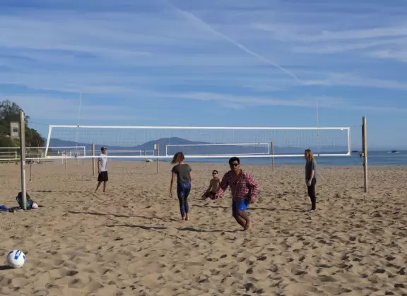 A wide sandy beach that's fun for kids! Wonderful for a long walk around the red cliffs.