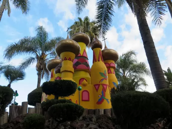 Mini-golf park with lush, colorful grounds, plus arcade games, mini-carousel, and rides.