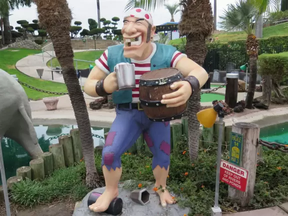 Mini-golf park with lush, colorful grounds, plus arcade games, mini-carousel, and rides.