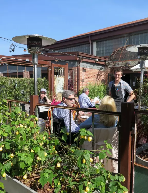 Hip area with wine bars, cafes, and bakeries, where you can sit on a patio surrounded by ivy-covered walls.