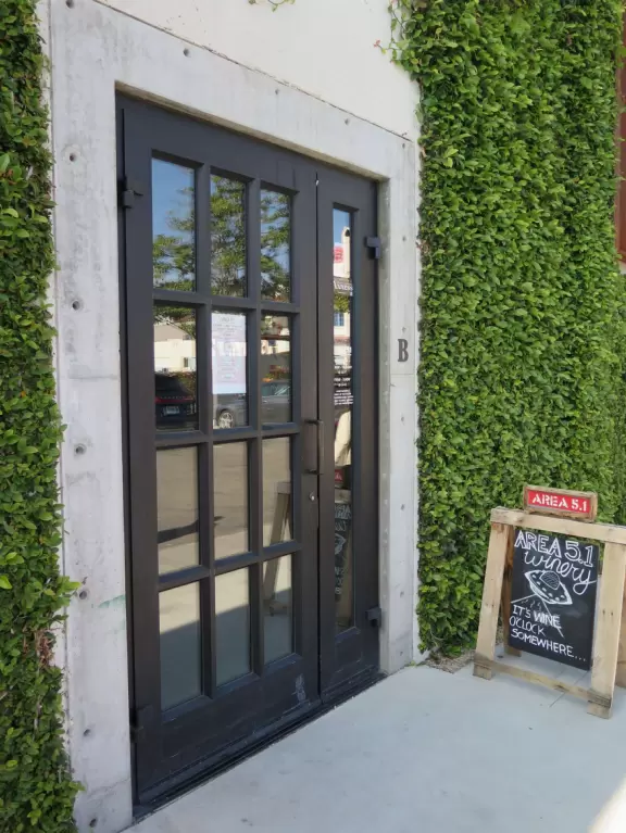 Hip area with wine bars, cafes, and bakeries, where you can sit on a patio surrounded by ivy-covered walls.