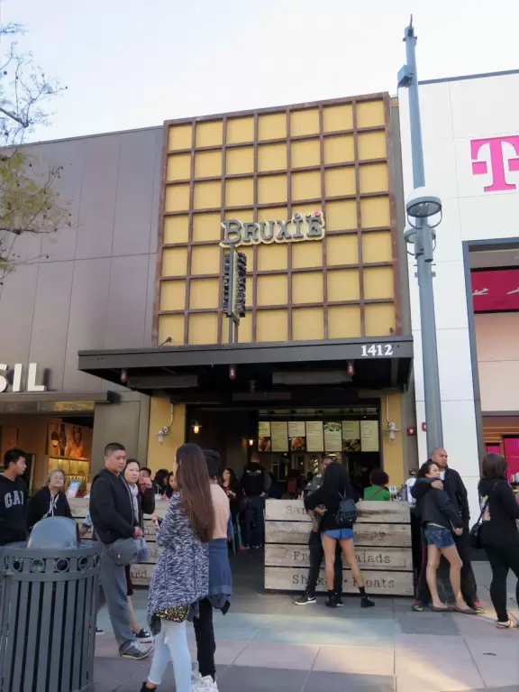 A pretty, pedestrian-only street, with performers, tons of people, and lots of shopping.