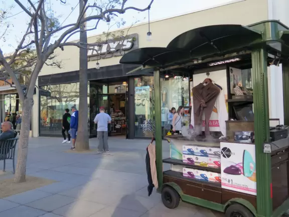 A pretty, pedestrian-only street, with performers, tons of people, and lots of shopping.