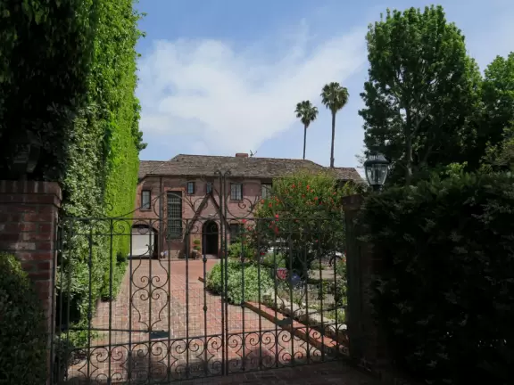 Walk past the mansion of Beverly Hills.