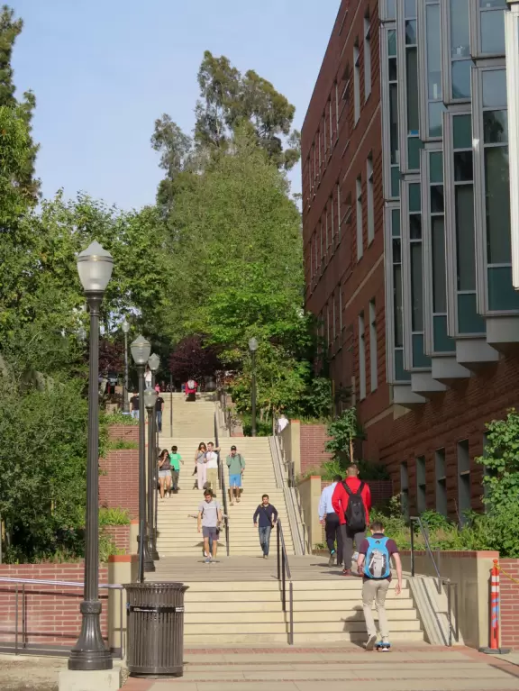 Gorgeous campus with Romanesque Revival architecture, huge sloping lawns, and old trees.