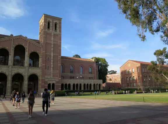 Gorgeous campus with Romanesque Revival architecture, huge sloping lawns, and old trees.