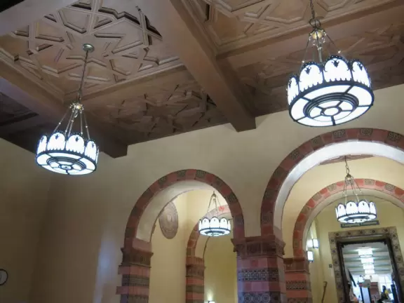 Gorgeous campus with Romanesque Revival architecture, huge sloping lawns, and old trees.