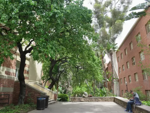 Gorgeous campus with Romanesque Revival architecture, huge sloping lawns, and old trees.
