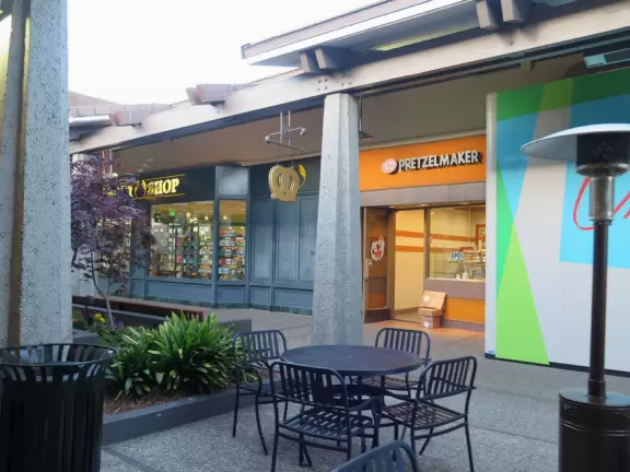 Modern shopping center with lovely views of the forest-covered hills.