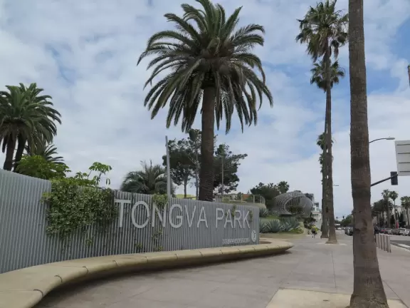 Modern, landscaped park with playground, fountains and impressive LED lights at night.
