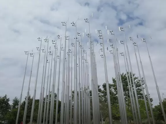 Modern, landscaped park with playground, fountains and impressive LED lights at night.