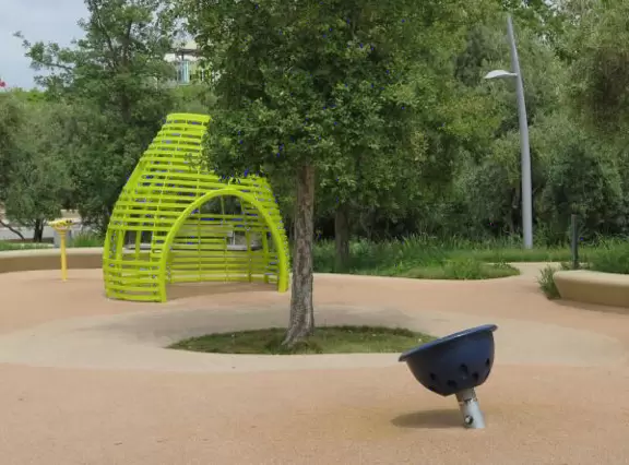 Modern, landscaped park with playground, fountains and impressive LED lights at night.