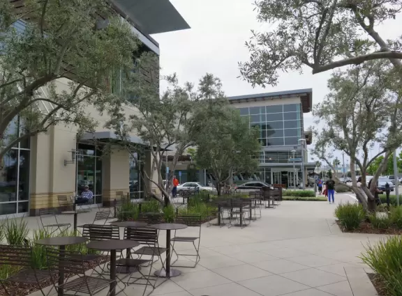 Modern mall with public spaces, fountains, splash pad, cafes, movie theater, and plenty of good shops.