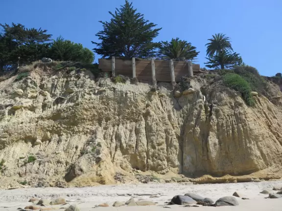 A wide sandy beach that's fun for kids! Wonderful for a long walk around the red cliffs.
