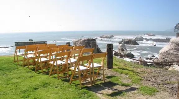 A great place to picnic or marry, with sea caves and jutting sea rocks below cliffs of hanging flowers.