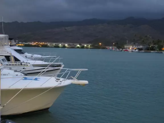 A marina and shopping center with romantic views and places to eat.