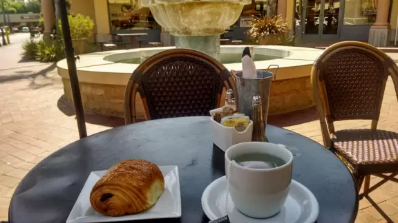 Italian restaurant with delicious gelato, independent bookstore, and excellent French bakery, plus castle tower and view of the mountains.