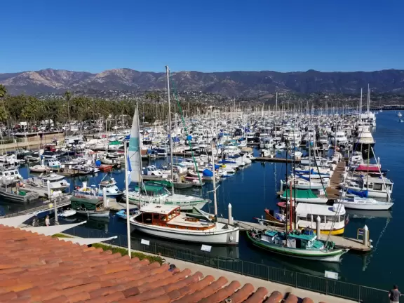 Stroll to the end of the breakwater while waves tumble over the sea wall! Sip a pomegranate margarita at an attractive bar!