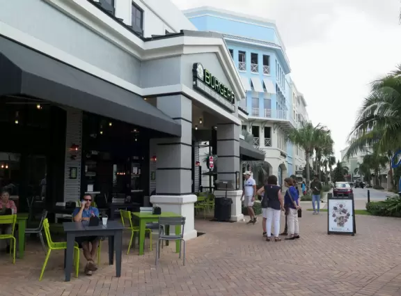 A happening spot with a sunken amphitheater by the water where kids can run in a splash pad and fountains are lit up at night.&nbsp; BurgerFi, Subculture Coffee, and a few restaurants.