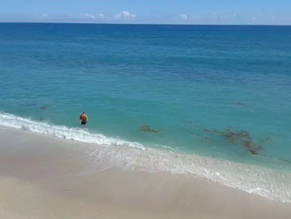 Long, narrow beach with a seawall backed by fancy hotels, a happening feel, and an oceanfront cafe.