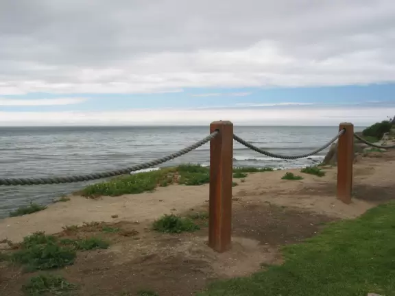 Small park in residential neighborhood with benches overlooking a pretty cove.
