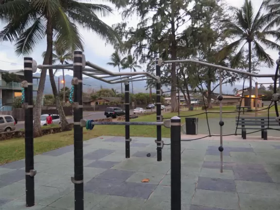 Sweet little beach with steep golden sand, shallow calm water, and a great playground and park full of people!