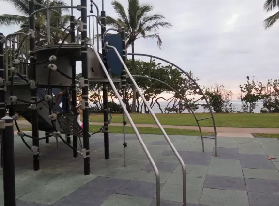 Sweet little beach with steep golden sand, shallow calm water, and a great playground and park full of people!
