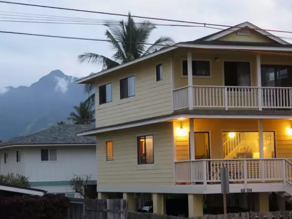 Sweet little beach with steep golden sand, shallow calm water, and a great playground and park full of people!
