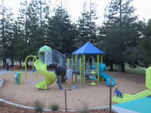Best playground you'll ever visit! Huge slides, hillside slides, steep grass slope for cardboard sledding, cable zipline, and pretty trees to picnic under.