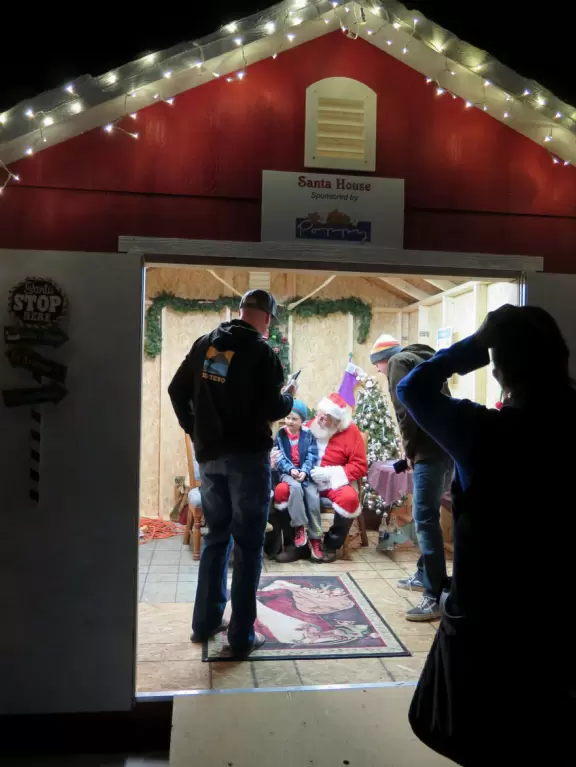 Santa's house is open at night in the early weeks of December.