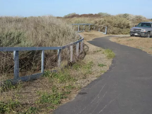 Lovely 0.7 mile walking path through the dunes filled with sage and flowers, past a playground, and behind some houses. Possible 3 mile walk, if you connect to Embarcadero.