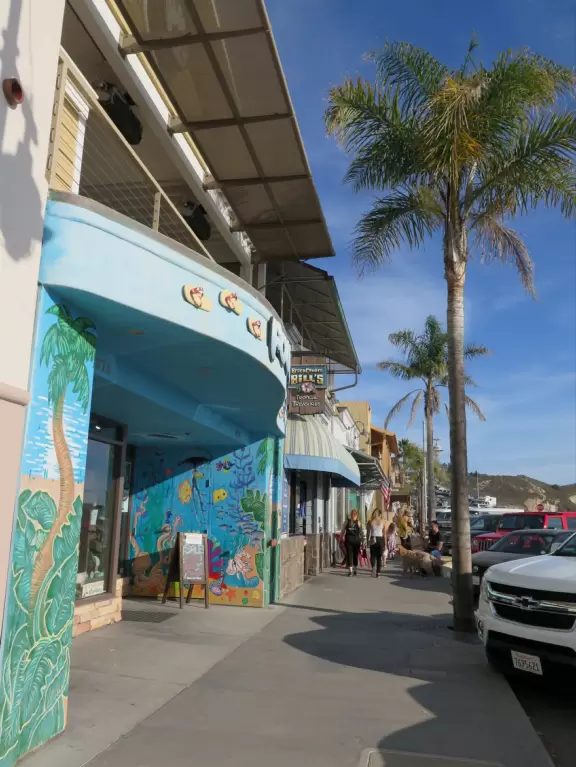 Colorful, pretty main street and boardwalk, with great cafes, lovely ship playground, and mesmerizing yellow cliffs.