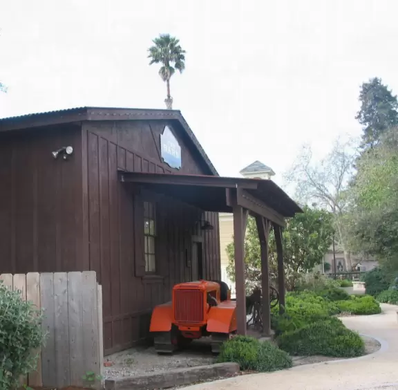 Nice little main street, with cafes, pretty storefronts, park, swinging bridge over a creek with tropical vegetation, and neighborhood with white picket fences and gardens.
