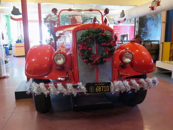 Attractive children's museum with market and carts, Newton's playhouse where you can shoot balls, ball pit, fire engine, oak tree tunnels, stage, dress-up area, and pizza kitchen.